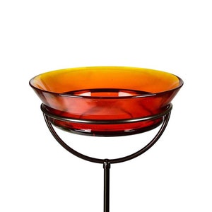 The Cuban Stake Bird Bath in orange against a white background.