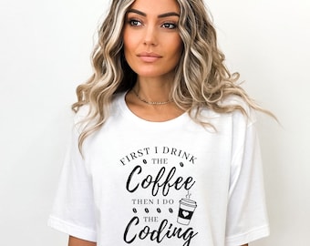 May include: White t-shirt with black text that reads "First I drink the coffee then I do the coding" with a coffee cup graphic.