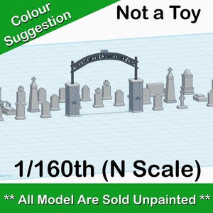 May include: A model train set of a cemetery with a gate and headstones in 1/160th scale. The sign above the gate reads "North Cemetery". The text below the image reads "Not a Toy" and "All Model Are Sold Unpainted".