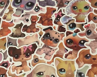 Può includere: Una collezione di adesivi colorati fustellati con vari personaggi di animali dei cartoni animati. Gli adesivi presentano una varietà di animali, tra cui cani, gatti e uccelli, con occhi grandi ed espressivi e disegni giocosi. Gli adesivi sono su sfondo bianco.