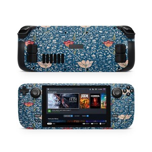 May include: A handheld gaming console with a floral design in shades of blue, red, and cream. The console's screen displays game titles. The design covers the entire device, including the buttons and the back.