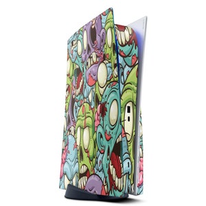 May include: A colorful skin for a gaming console featuring a pattern of green, blue, and purple zombie faces with red accents.