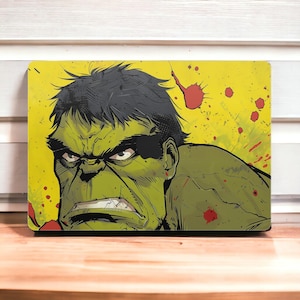 Può includere: Un primo piano del viso di Hulk, con uno sfondo verde e giallo. Hulk è arrabbiato e ha un'espressione determinata sul viso. Ci sono schizzi di vernice rossa sullo sfondo.