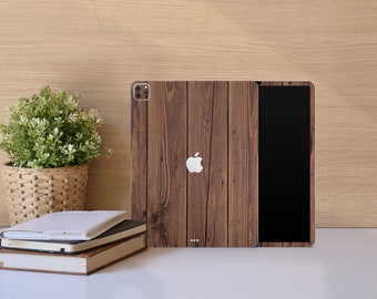 May include: A brown wood-grain patterned case for an iPad or tablet. The case has a black screen and a white Apple logo.