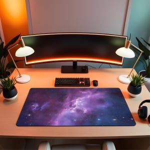 May include: A desk arrangement with a curved monitor, keyboard, and mouse. A mousepad with a purple and blue nebula design is the focal point. Two desk lamps and potted plants are positioned around the monitor, creating a modern workspace.