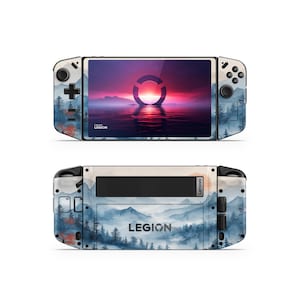 May include: A white and blue handheld gaming console with a screen displaying a sunset scene. The console has a Lenovo Legion logo and a circular design on the screen. The console is on a white background.