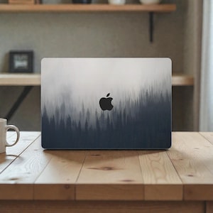 Vinilo adhesivo para MacBook con silueta de bosque