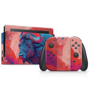 May include: A red, pink, and blue abstract design with a blue buffalo silhouette on the Nintendo Switch console and matching Joy-Con controllers.
