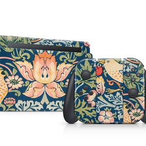 May include: A blue and green floral patterned Nintendo Switch console and controller skin. The design features a repeating pattern of flowers, birds, and leaves.