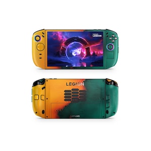 May include: A handheld gaming device with a yellow and green color scheme. The front displays a vibrant screen with a futuristic scene. The back features the word "LEGION" and the Lenovo logo. Buttons and controls are visible on the device.