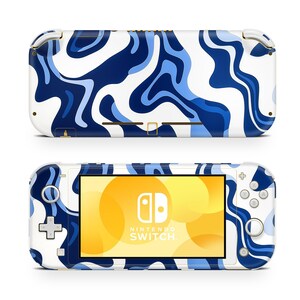 May include: A white and blue Nintendo Switch Lite console with a marbled design. The console has a yellow screen with the Nintendo Switch logo and text.