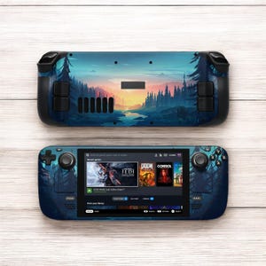 May include: A blue and black handheld gaming console with a forest scene on the back. The front screen shows a menu with recent games, including Star Wars Jedi: Fallen Order, Doom Eternal, and Control. The console has a joystick, buttons, and a screen.