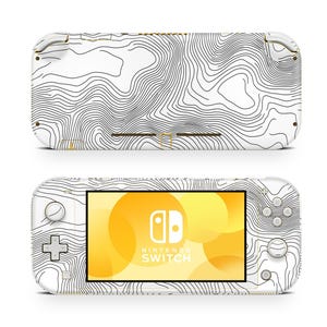 May include: White Nintendo Switch Lite console skin with a black and white topographic map design. The skin covers the front and back of the console. The Nintendo Switch Lite logo is visible on the screen.