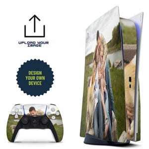 May include: A white PlayStation 5 console with a custom skin featuring a family photo of a couple and their child. The photo shows the family standing in a grassy field with a dog. The console is on a white surface.