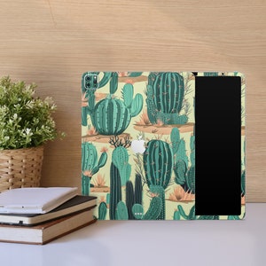 May include: A green and yellow cactus patterned iPad case with a black screen protector. The case has a variety of cactus designs, including saguaro, barrel, and prickly pear.