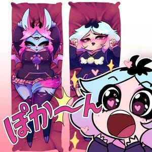 May include: Two rectangular body pillows featuring anime-style illustrations of characters with pink, blue, and black color schemes. One character has three eyes and bat wings, while the other has short hair and a pendant. Japanese text is visible.