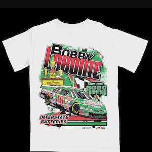May include: White t-shirt with a green and red graphic of a race car with the text "Bobby Labonte 2000 Champion" and "Interstate Batteries".