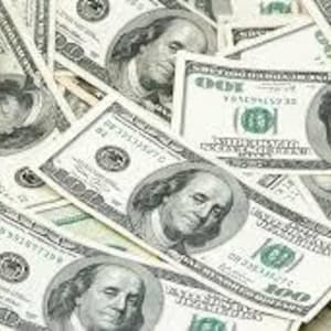 May include: A pile of United States one hundred dollar bills. Each bill features a portrait of Benjamin Franklin and the number 100. The bills are green and white, with various serial numbers visible.