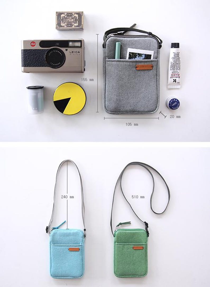 Puede incluir: Una colecci&oacute;n de accesorios que incluye un bolso bandolera gris (10,5 cm x 15,5 cm), un bolso bandolera azul claro (correa de 24 cm) y un bolso bandolera verde (correa de 51 cm). Tambi&eacute;n se muestra una c&aacute;mara, un cartucho de pel&iacute;cula y otros objetos peque&ntilde;os.