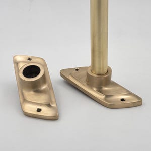 May include: A set of three ceramic mugs with a speckled, matte finish in cream, light grey, and dark grey. Each mug has a simple, minimalist design, suitable for coffee or tea.