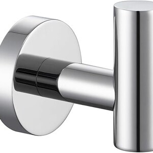 May include: A silver metal hook with a round base. The hook is designed for hanging items on a wall.