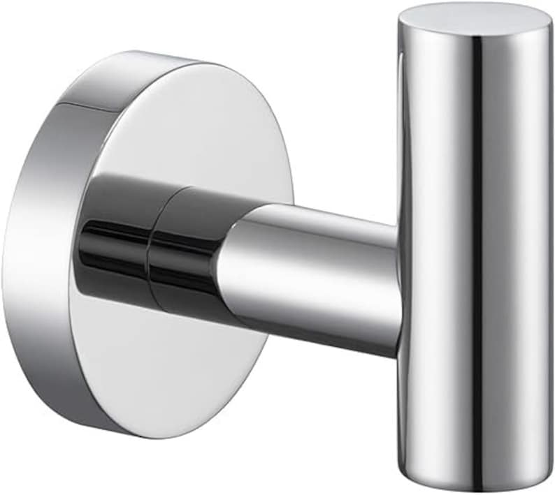 May include: A silver metal hook with a round base. The hook is designed for hanging items on a wall.