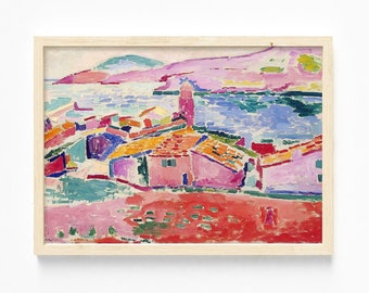 May include: A colourful painting of a seaside village with pink and red houses, a blue sea, and green hills in the background.