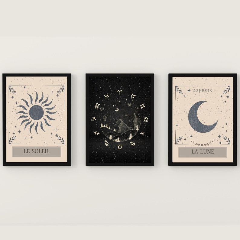 May include: Three framed prints with a celestial theme. The first print features a sun with rays, the second print features a crescent moon with stars and zodiac symbols, and the third print features a crescent moon with stars. The prints are all in black frames with a cream background.