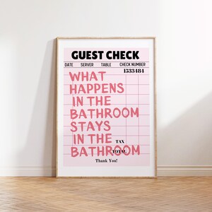 May include: A pink and white guest check with the text "GUEST CHECK" at the top and the phrase "WHAT HAPPENS IN THE BATHROOM STAYS IN THE BATHROOM" in black text. The check number is 1533484.
