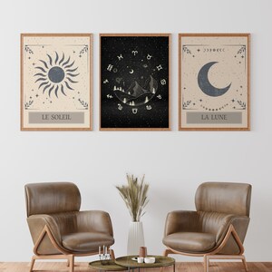 May include: Three framed prints with celestial imagery. The left print features a sun with the text "Le Soleil". The center print features a mountain range with celestial symbols and the text "Le Soleil". The right print features a crescent moon with the text "La Lune".
