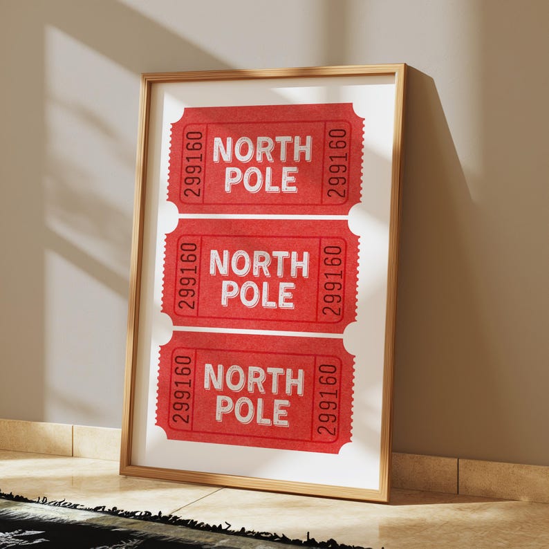 May include: A framed print with three red tickets that say "North Pole" with the number "299160" on each ticket.