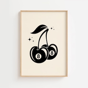 May include: Framed art print in black and white, depicting two cherries, each with the number 8, styled like billiard balls. A green leaf and starbursts are also included. The print is set against a cream-colored background.