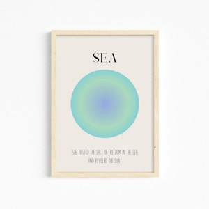 May include: A minimalist poster with the word "SEA" in black text on a beige background. A blue, green, and yellow gradient circle is in the center of the poster. The quote "SHE TASTED THE SALT OF FREEDOM IN THE SEA, AND REVELED THE SUN" is below the circle.