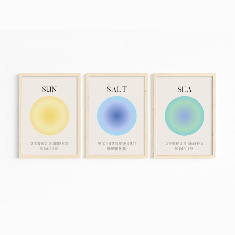 May include: Three framed prints with a minimalist design. Each print features a circle with a gradient color scheme. The top of each print has a word in black text: "SUN", "SALT", and "SEA". The bottom of each print has the same text in smaller font: "She tasted the salt of freedom in the sea and revealed the sun."