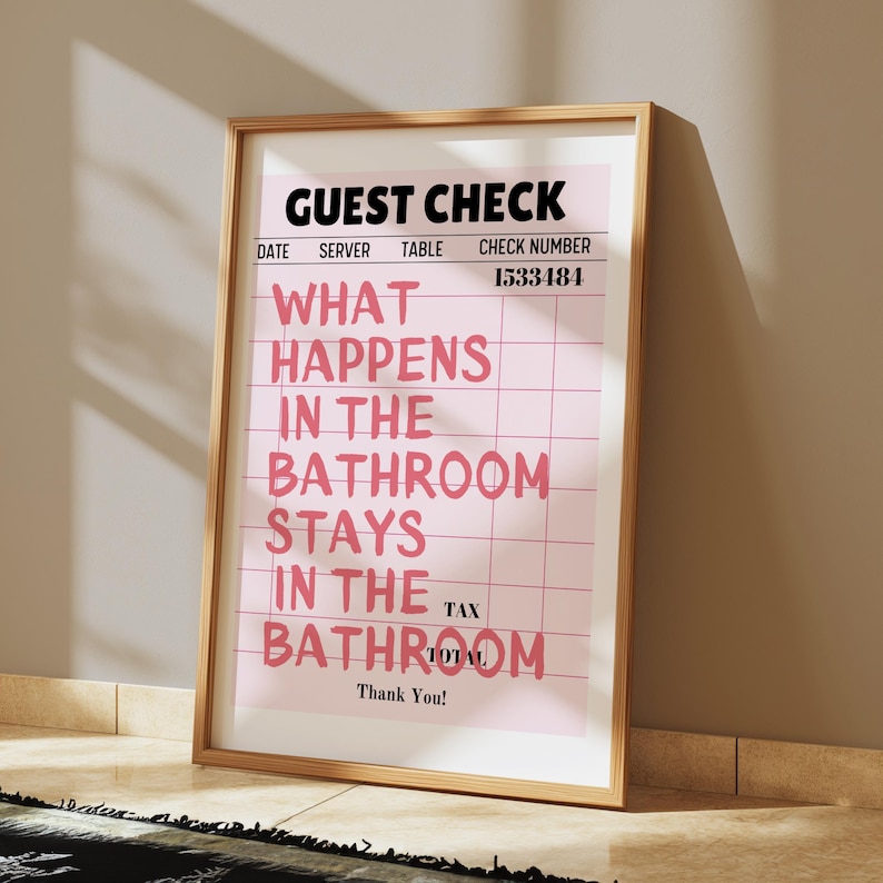 May include: A pink and white guest check with the text "What happens in the bathroom stays in the bathroom" in black text. The check number is 1533484.