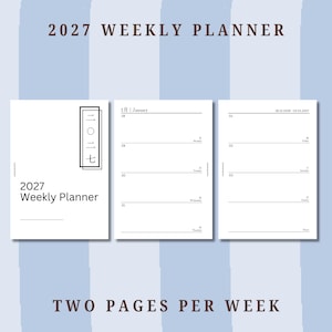 May include: A 2027 weekly planner with a white cover featuring black text and a vertical rectangular frame containing Japanese characters. The interior pages show a two-page weekly layout with horizontal lines for daily entries and dates.