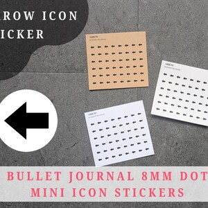 May include: Black arrow icon stickers on kraft paper and white sheets. The stickers are arranged in a grid. A large black arrow in a white circle is also shown. Text reads "ARROW ICON STICKER" and "BULLET JOURNAL 8MM DOT MINI ICON STICKERS."