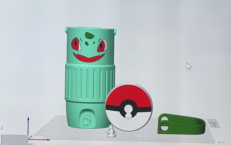 May include: A collection of 3D-printed items featuring a Bulbasaur-themed water bottle, a Pok&eacute; Ball-shaped lid, and a green clip. The Bulbasaur bottle is light green with a smiling face. The Pok&eacute; Ball lid is red and white.
