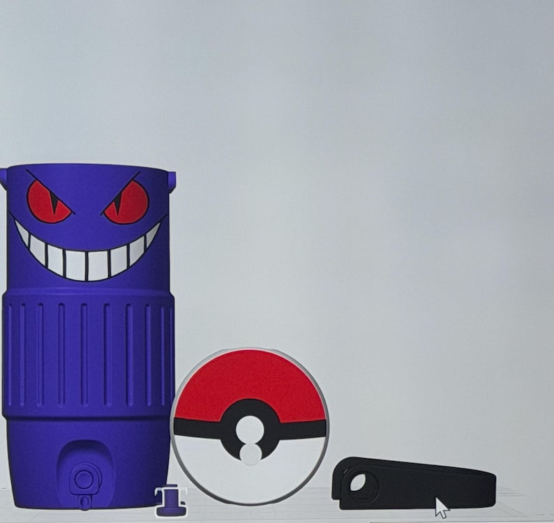 May include: A purple tumbler with a Gengar face design, a red and white Pokeball coaster, a small black accessory, and a small purple piece. The tumbler has a cylindrical shape.