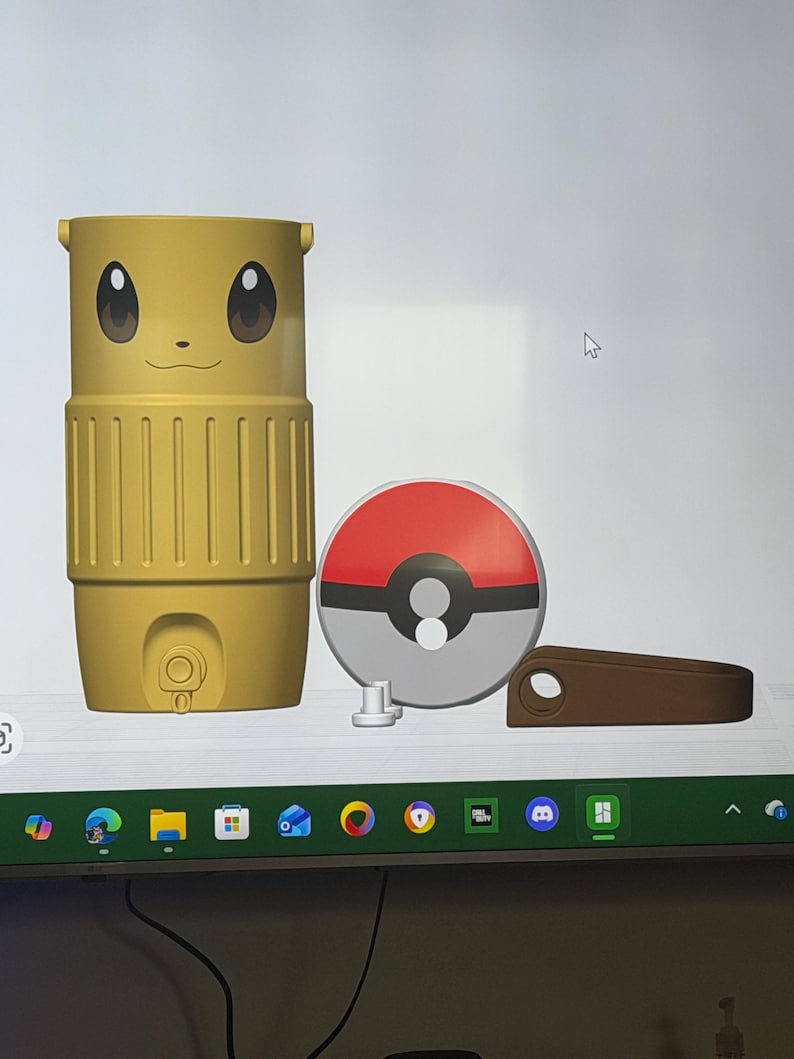 May include: A yellow travel mug with a cartoon face, a red and white Pok&eacute; Ball, and a brown handle. The mug has a cylindrical shape with a ribbed design and a small button. The Pok&eacute; Ball is round with a white center.