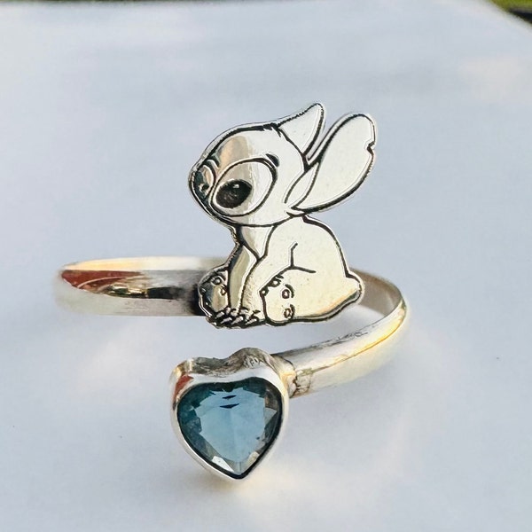 925 sterling silver, ring with blue cubic zirconia fits on any finger