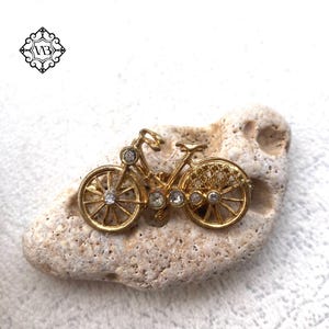 Vintage fietsbroche met strassteentjes