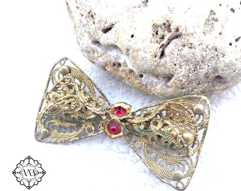 Broche vintage tchèque en laiton avec noeud en filigrane