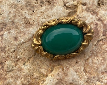 Vintage oval brass brooch with green cabochon