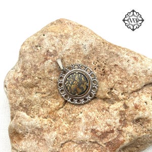 Vintage tiny Toledo Damascene birdie pendant