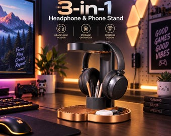 Peut inclure: Un support 3-en-1 noir et bronze pour casque et téléphone, doté d'une plateforme supérieure, d'un support vertical central avec un porte-stylo circulaire et d'un large plateau de base. Il maintient un casque audio noir et des stylos.