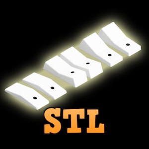 Puede incluir: Seis piezas de plástico blanco con un punto negro en cada pieza. Las piezas están dispuestas en una fila, con la pieza más grande a la derecha y la más pequeña a la izquierda. Las piezas están etiquetadas como "STL".