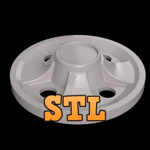 May include: A gray plastic wheel cover with five holes and the word "STL" printed on the bottom.