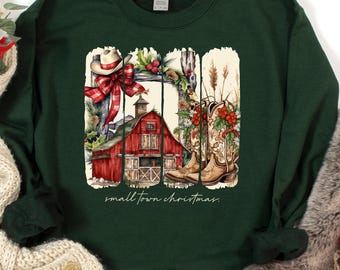 May include: A dark green sweatshirt with a Christmas graphic. The graphic shows a red barn, cowboy boots, and a cowboy hat. The text "small town christmas" is below the graphic. A cream scarf and a faux fur stocking are also in the image.