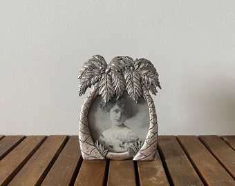 Small vintage pewter picture frame with palm trees